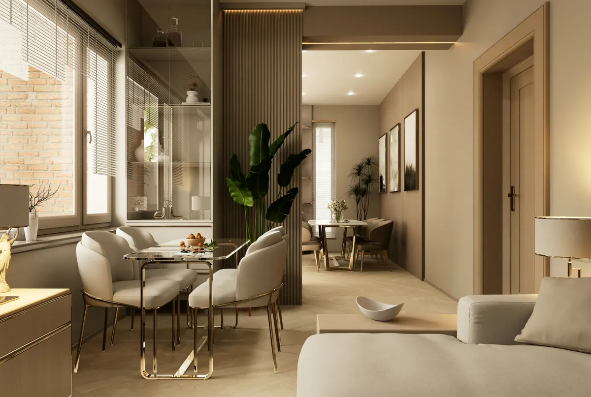 Séjour et coin repas d’un appartement rénové, mur de briques, parquet en chevrons et tons beiges